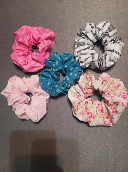 5 scrunchies all made of different fabric.